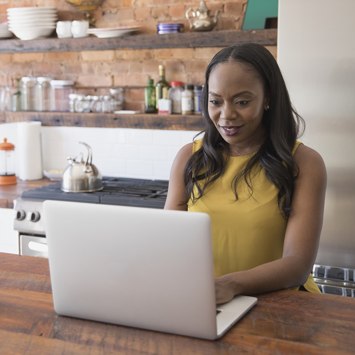 Businesswoman working on her laptop from home